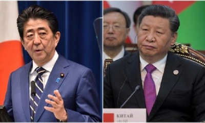 El primer ministro de Japón, Shinzo Abe, y el presidente de China, Xi Jinping. | Fuente: AFP/EFE
