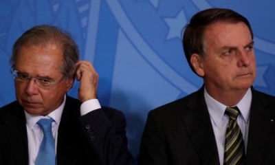 El ministro de economía brasileño, Paulo Guedes, junto al presidente Jair Bolsonaro. / Reuters