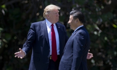 El presidente estadounidense Donald Trump junto a su homólogo chino Xi Jinping. 