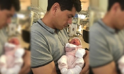 El arquero boliviano Carlos Lampe,  junto a su pequeña hija.