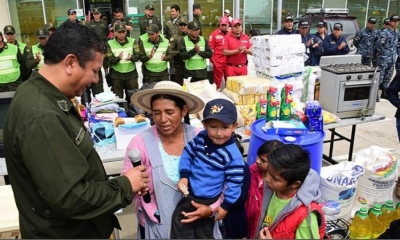 Entrega de productos recolectados a familia de escasos recursos.