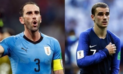 Godín y Griezman, compañeros en el Atlético de Madrid, se verán las caras hoy en busca de las ‘semis’. Foto: AFP