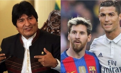 Evo Morales del lado izquierdo y los famosos futbolistas Lionel Messi y Cristiano Ronaldo, a la derecha. | Fuente: EFE