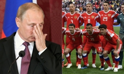 Vladímit Putin durante una conferencia en Viena. A su lado, parte del equipo de la Selección de Rusia que empató ante Turquía en Moscú